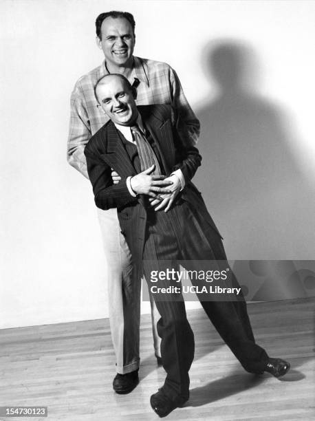 American photographers Ansel Adams and Willard Morgan clown about in a photo studio, Scarsdale, New York, 1942. The studio belonged to Barbara Morgan...