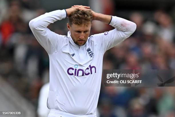 England's Joe Root reacts while bowling on day four of the fourth Ashes cricket Test match between England and Australia at Old Trafford cricket...