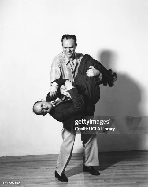 American photographers Ansel Adams and Willard Morgan clown about in a photo studio, Scarsdale, New York, 1942. The studio belonged to Barbara Morgan...