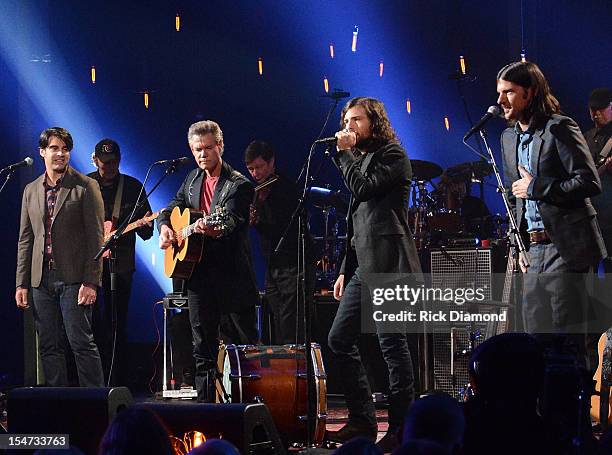 Bob Crawford - Avett Brothers, Randy Travis, Scott Avett and Seth Avett perform during CMT Crossroads: The Avett Brothers And Randy Travis tape at...