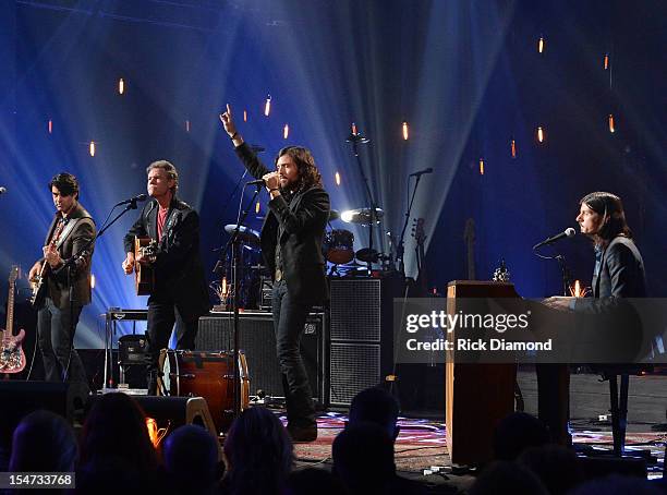 Bob Crawford - Avett Brothers, Randy Travis, Scott Avett and Seth Avett perform during CMT Crossroads: The Avett Brothers And Randy Travis tape at...