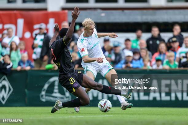 Kevin Keben of FC Toulouse and Leon Opitz of SV Werder Bremen battle for the ball during the Pre-Season Friendly match between SV Werder Bremen and...