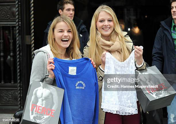 Young women pose for photographs outside Abercrombie & Fitch during the opening of Abercrombie & Fitch flagship store on October 25, 2012 in Munich,...