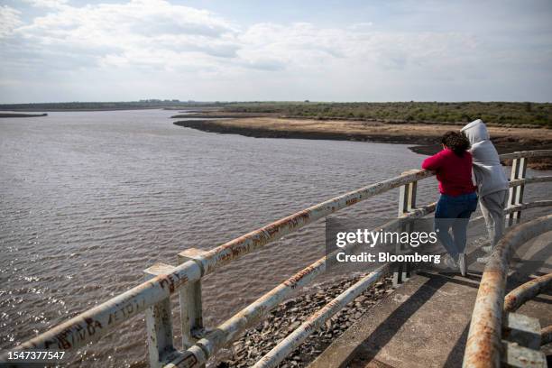 Visitors view low water levels at the Paso Severino reservoir during a drought in Florida, Uruguay, on Friday, July 21, 2023. Paso Severino, the main...