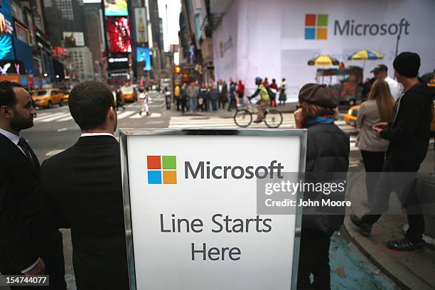 Microsoft employees await customers Thursday morning ahead of the opening of the Times Square Microsoft store on October 25, 2012 in New York City....