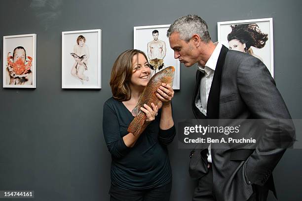 Greta Scacchi and Mark Foster attend a photocall ahead of the private view of Rankin: Fishlove on October 25, 2012 in London, England.