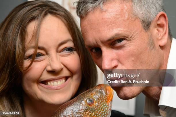 Greta Scacchi and Mark Foster attend a photocall ahead of the private view of Rankin: Fishlove on October 25, 2012 in London, England.