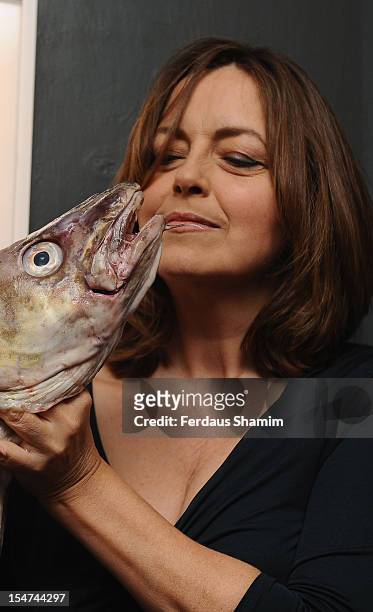 Greta Scacchi attends a photocall ahead of the private view of Rankin: Fishlove on October 25, 2012 in London, England.
