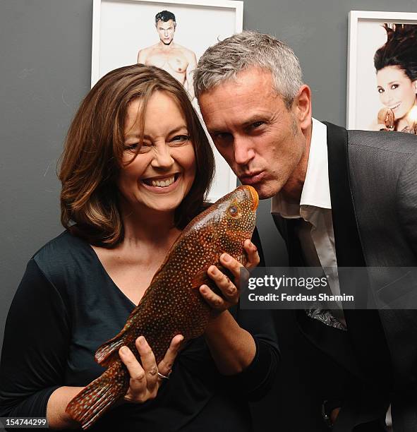 Greta Scacchi and Mark Foter attend a photocall ahead of the private view of Rankin: Fishlove on October 25, 2012 in London, England.