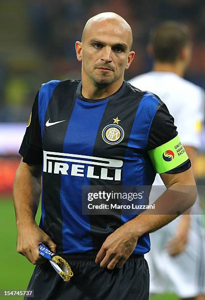 Esteban Cambiasso captain of FC Internazionale Milano wears a 'Unite against Racism' arm band alongside a young mascot to highlight UEFA's FARE...