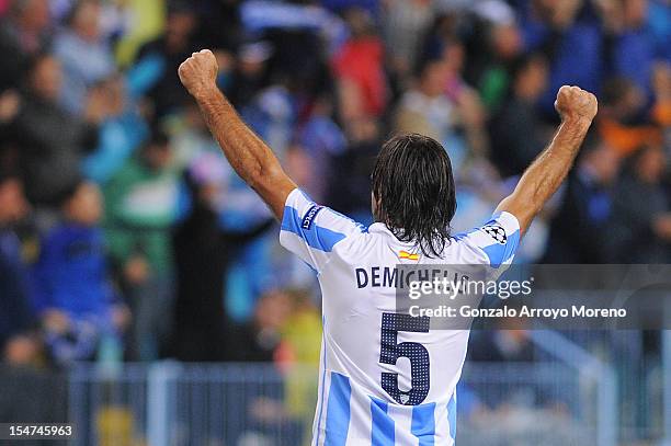 Martin Demichelis of Malaga CF celebrates scoring their first goal during the UEFA Champions League group C match between Malaga CF and AC Milan at...