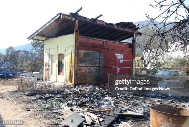 Fire damage on a building after a forest fire swept through the village of Grebastica near Sibenik, Croatia on July 14, 2023. A forest fire started...