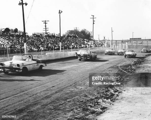 April 29, 1956: Dink Widenhouse leads Tom Pistone and the rest of the field during the NASCAR Convertible Division race at Greensboro Fairgrounds.