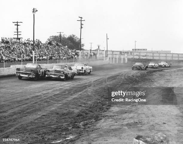 April 29, 1956: Dave Hirschfield dices with eventual race winner Bob Welborn during the NASCAR Convertible Division race at Greensboro Fairgrounds....