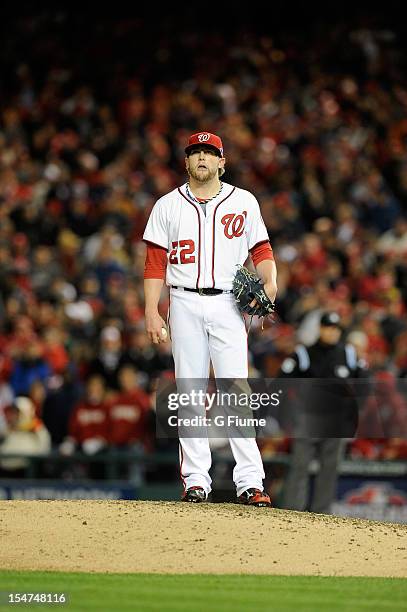 Drew Storen of the Washington Nationals reacts after given up a run against the St. Louis Cardinals in Game Five of the National League Division...