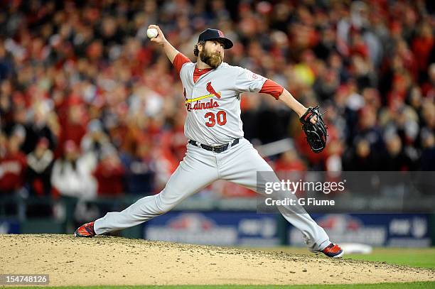 Jason Motte of the St. Louis Cardinals pitches against the Washington Nationals in Game Five of the National League Division Series at Nationals Park...