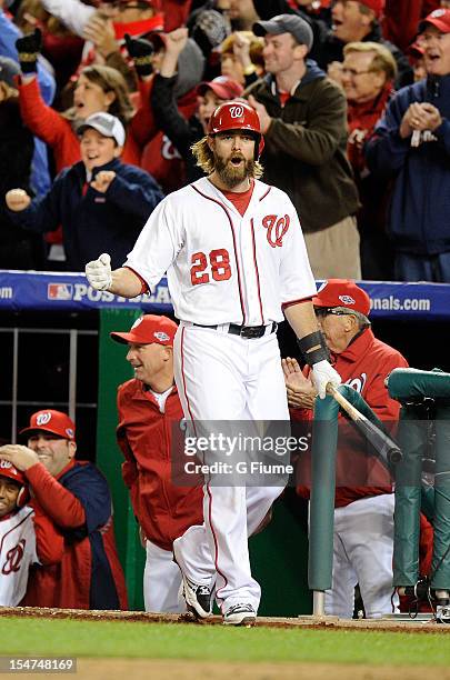 Jayson Werth of the Washington Nationals celebrates after the Nationals score a run against the St. Louis Cardinals in Game Five of the National...