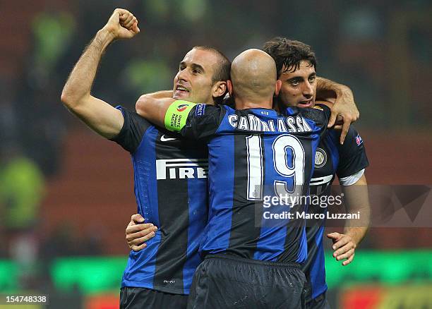 Rodrigo Palacio of FC Internazionale Milano celebrates with his team-mate Esteban Cambiasso and Diego Alberto Milito after scoring the opening goal...