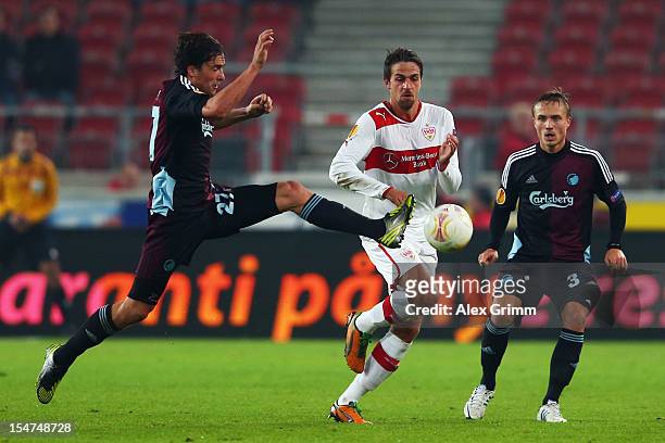 Martin Harnik 8c9 of Stuttgart is challenged by Thomas Delaney and Pierre Bengtsson of Copenhagen during the UEFA Europa League group E match between...