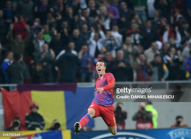 Vlad Chiriches of Steaua Bucaresti celebrates after scoring during the UEFA Europa League Group E football match FC Steaua Bucaresti vs Molde FK in...