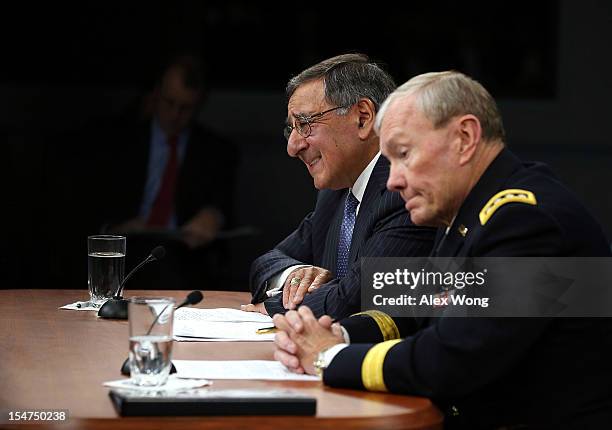 Secretary of Defense Leon Panetta and Chairman of the Joint Chiefs of Staff General Martin Dempsey participate during a news briefing October 25,...