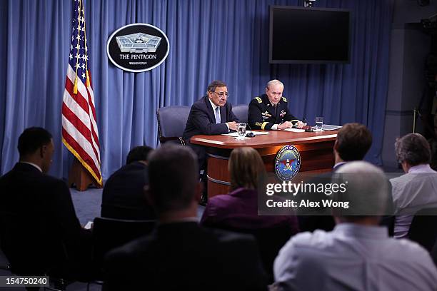 Secretary of Defense Leon Panetta and Chairman of the Joint Chiefs of Staff General Martin Dempsey participate during a news briefing October 25,...