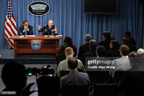 Secretary of Defense Leon Panetta and Chairman of the Joint Chiefs of Staff General Martin Dempsey participate during a news briefing October 25,...