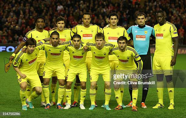 The FC Anji Makhachkala players line up for a team photo prior to the UEFA Europa League Group A match between Liverpool FC and FC Anzhi Makhachkala...