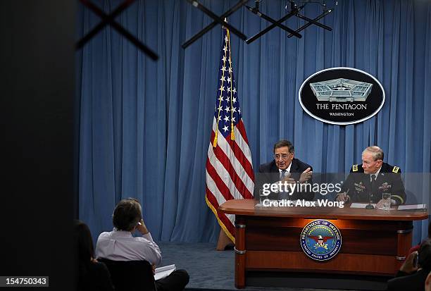 Secretary of Defense Leon Panetta and Chairman of the Joint Chiefs of Staff General Martin Dempsey participate during a news briefing October 25,...