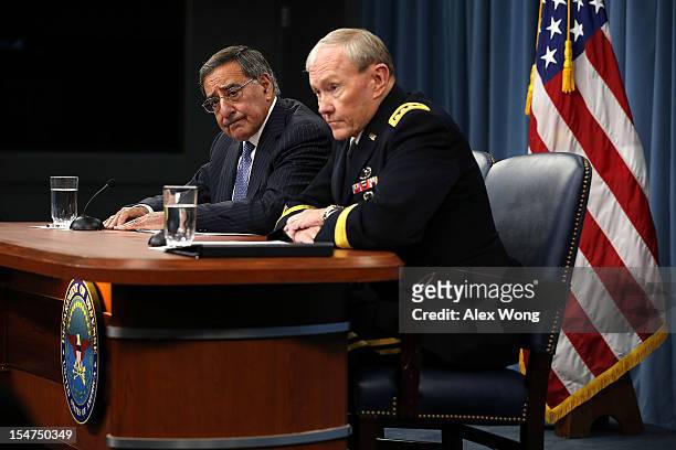 Secretary of Defense Leon Panetta and Chairman of the Joint Chiefs of Staff General Martin Dempsey participate during a news briefing October 25,...