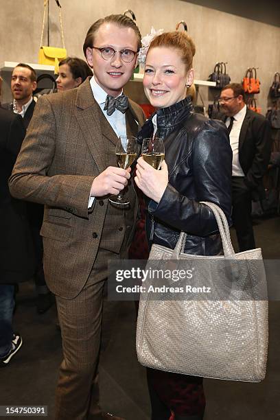 Jan-Henrik M. Scheper-Stuke and Enie van de Meiklokjes attend the 'Le Tanneur' store opening at Quartier 207 on October 25, 2012 in Berlin, Germany.