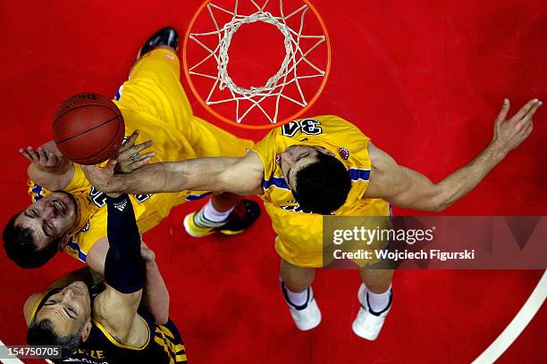 Rasid Mahalbasic, #12 and Adam Hrycaniuk, #34 of Asseco Prokom Gdynia competes with Sven Schultze, #6 of Alba Berlin in action during the 2012-2013...