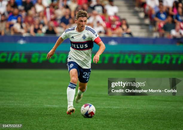 Ryan Gauld, captain of the Vancouver Whitecaps FC dribbles the ball up field against Los Angeles Galaxy at BC Place on July 15, 2023 in Vancouver,...