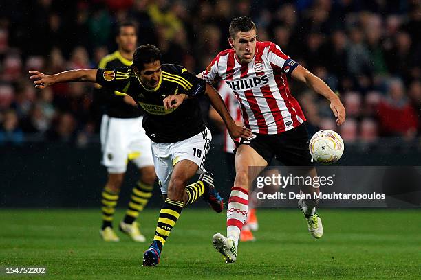 Kevin Strootman of PSV and Celso Borges of AIK battle for the ball during the UEFA Europa League Group F match between PSV Eindhoven and AIK Solna at...