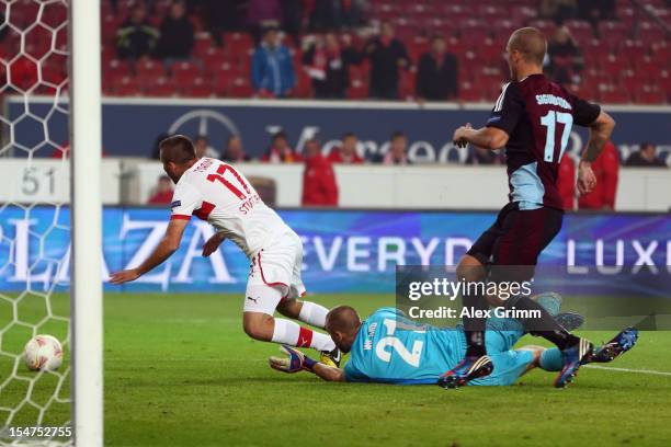 Tunay Torun of Stuttgart is challenged by Goalkeeper Johan Wiland of Copenhagen during the UEFA Europa League group E match between VfB Stuttgart and...