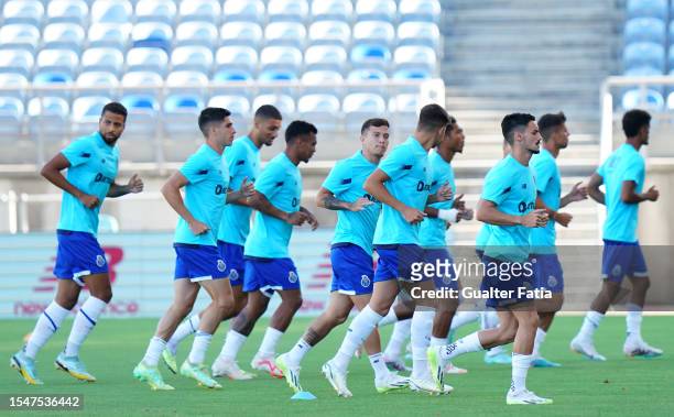Stephen Eustaquio of FC Porto with teammates in action during the warm up before the start of Pre-Season Friendly match between Cardiff City FC and...