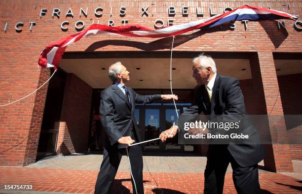 Francis X. Bellotti, right, and David H. Souter, a former associate justice of the United States Supreme Court, left, unveiled the new name on the...