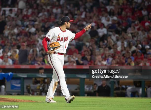 Anaheim, CA Angels star starting pitcher, two-way player and designated hitter Shohei Ohtani leaves the mound and points to the crowd after pitching...