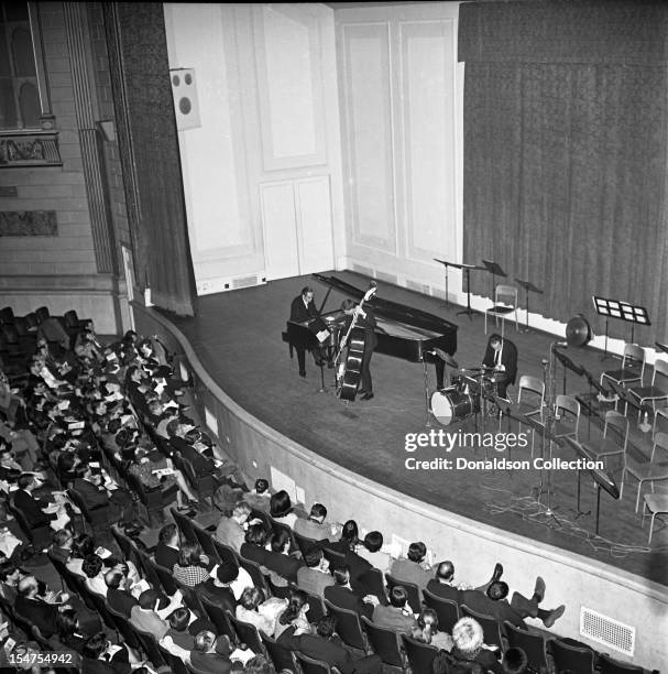 Jazz pianist and composer Bill Evans performs at Town Hall with bassist Chuck Israels and drummer Arnie Wise on February 21, 1966 in New York, New...