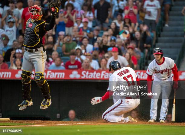 Anaheim, CA Angels starting pitcher and two-way player Shohei Ohtani scores past Pirates catcher Endy Rodríguez on Angels center fielder Mickey...