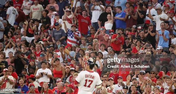 Anaheim, CA Fans cheer as they get a close up view of Angels star starting pitcher, two-way player and designated hitter Shohei Ohtani, during a game...