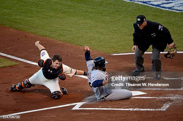 Catcher Buster Posey of the San Francisco Giants tags out Prince Fielder of the Detroit Tigers at home plate in the second inning during Game Two of...