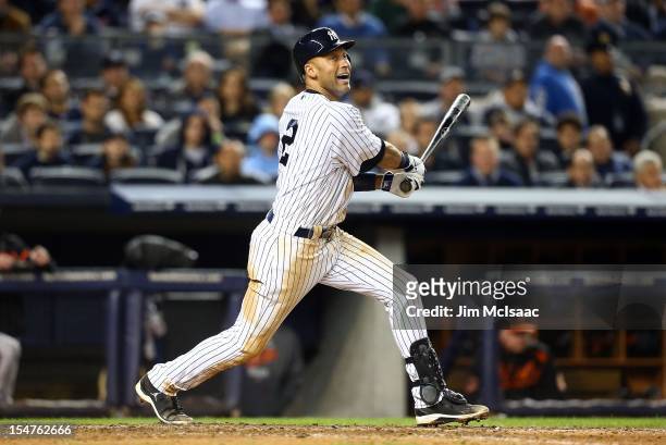 Derek Jeter of the New York Yankees in action against the Baltimore Orioles during Game Three of the American League Division Series at Yankee...
