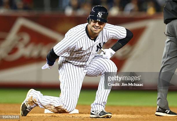 Nick Swisher of the New York Yankees in action against the Baltimore Orioles during Game Three of the American League Division Series at Yankee...