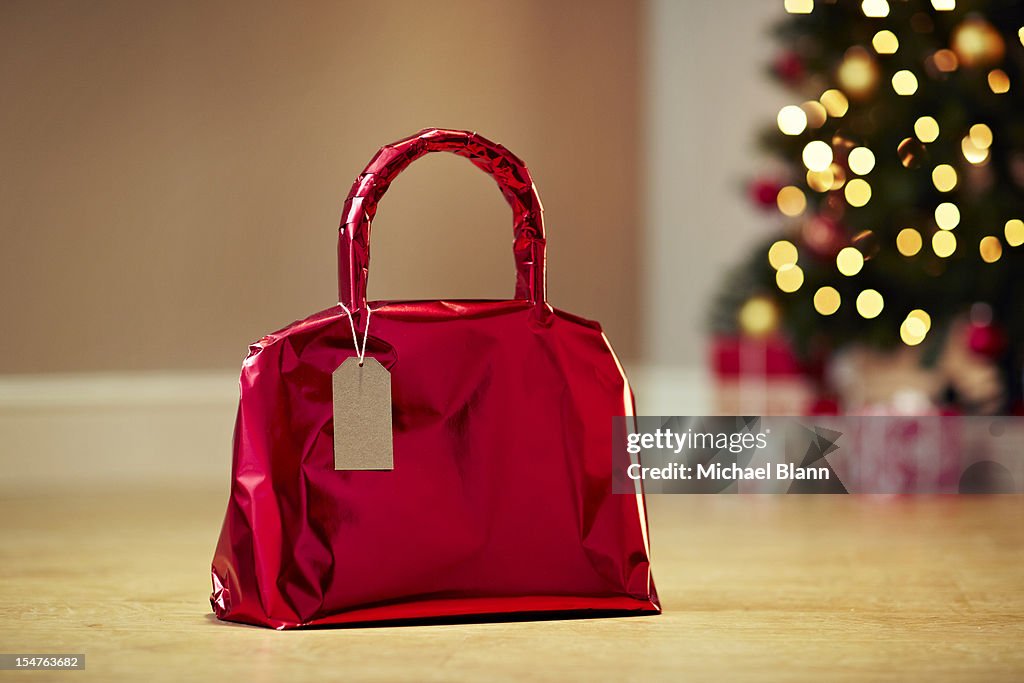Handbag gift wrapped with Christmas tree
