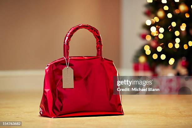 handbag gift wrapped with christmas tree - christmas tree presents stock pictures, royalty-free photos & images