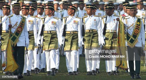 The Royal Malay Regiment march in front of Malaysia's King Sultan Mizan Zainal Abidin during his birthday celebration in Kuala Lumpur on June 4,...