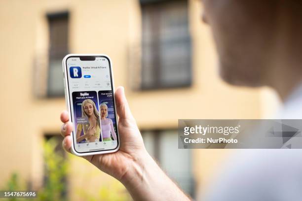 This illustration photo shows a user interacting with a smartphone app to customize an avatar for a personal artificial intelligence chatbot, known...