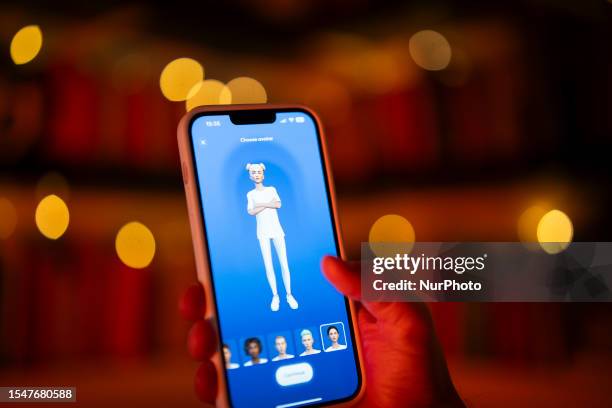 This illustration photo shows a user interacting with a smartphone app to customize an avatar for a personal artificial intelligence chatbot, known...