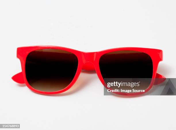 pair of red sunglasses - sunglasses foto e immagini stock